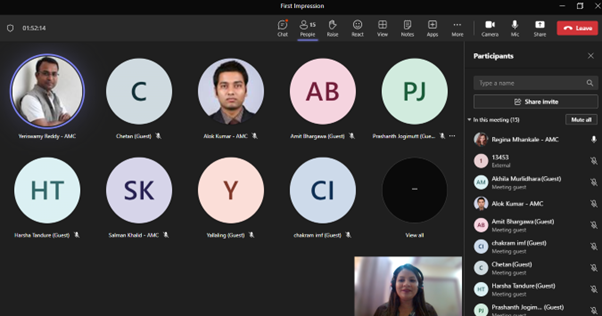 A virtual meeting interface displaying multiple participants' video feeds and names in a grid layout, with one woman visible in the lower right corner speaking to the group.